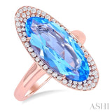 18x8 MM Oval Cut Blue Topaz and 1/3 ctw Round Cut Diamond Halo Semi Precious Ring in 14K Rose Gold