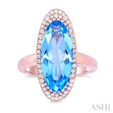 18x8 MM Oval Cut Blue Topaz and 1/3 ctw Round Cut Diamond Halo Semi Precious Ring in 14K Rose Gold
