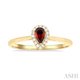 5x3 MM Pear Shape Garnet and 1/20 Ctw Single Cut Diamond Halo Semi-Precious Ring in 10K Yellow Gold