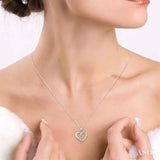 1/10 ctw Round Cut Diamond Heart Shape Journey Pendant in 10K White Gold with Chain