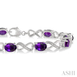 7x5 MM Oval Cut Amethyst and 1/10 ctw Round Cut Diamond Semi Precious Infinity Bracelet in Sterling Silver